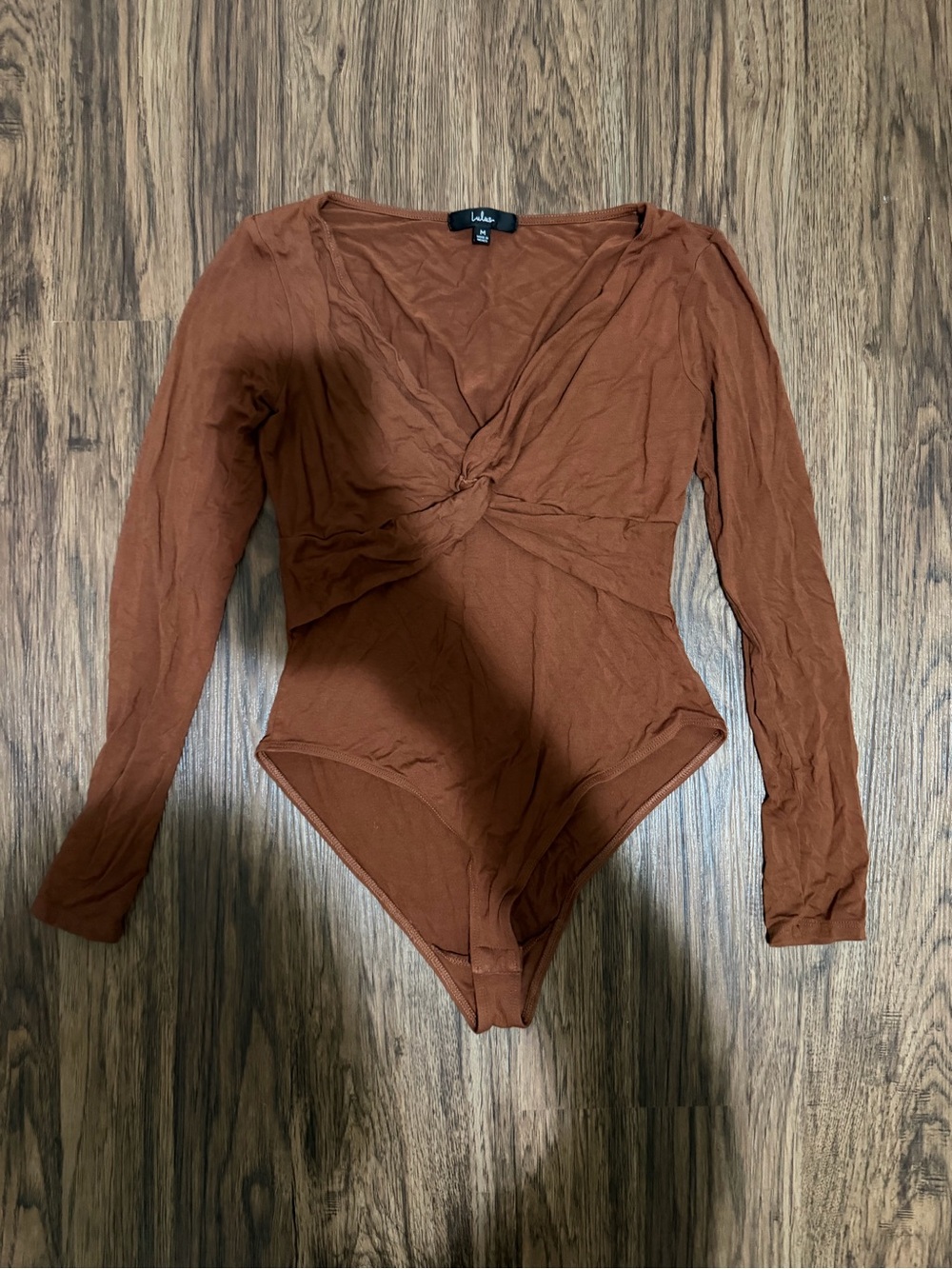 Lulu's rust twist knot long sleeve bodysuit